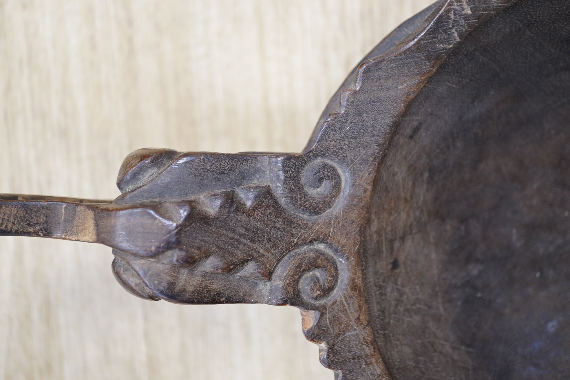 A carved South East Asian bowl, diameter 22cm, overall length 51.5cm. Condition - fair to good